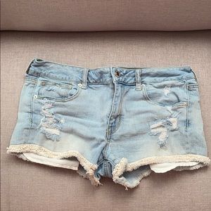 Light wash distressed American eagle jean shorts